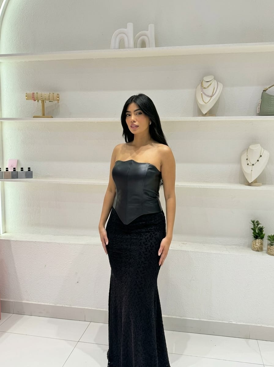 Dress with a faux leather corset bodice and jacquard fabric