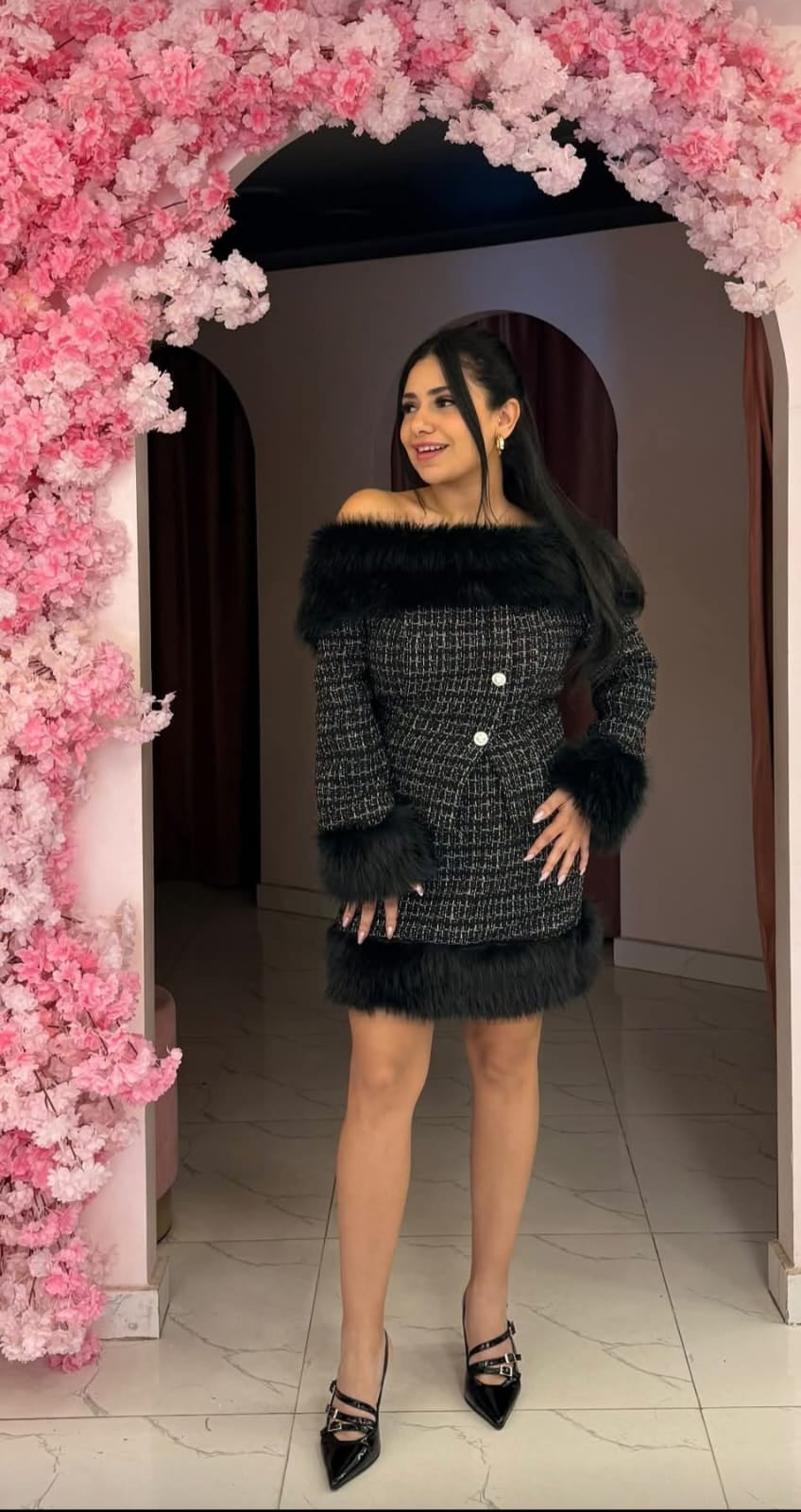 Winter elegance: Tweed skirt set trimmed with faux fur