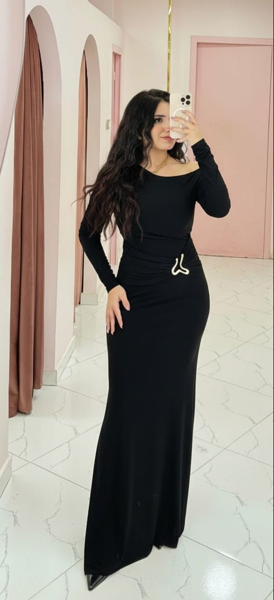 Elegant off-the-shoulder maxi dress with a ruffled design in dark burgundy