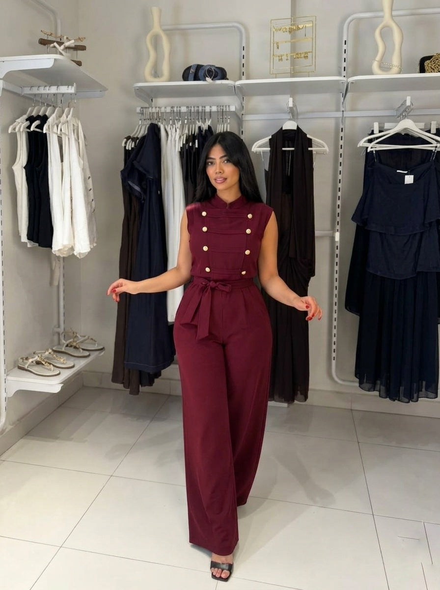 Elegant sleeveless double-breasted jumpsuit with a waist tie.
