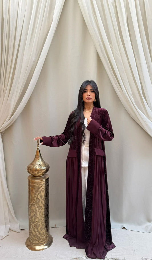A pleated Ramadan abaya with a shimmering midnight color design